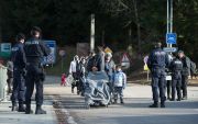 Refugees cross the border between Austria and Germany Photo by Lukas Barth/Anadolu Agency/Getty Images