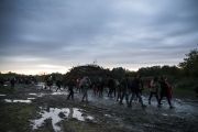  Migrants walk in puddles as they make their way after crossing the border at Zakany, Hungary Photo by Arpad Kurucz/Anadolu Agency/Getty Images