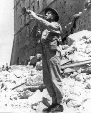 A bugler plays in the ruins of Monte Cassino. Photo: public domain. 