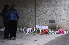 People stand at the memorial site near the center of Skärholmen, southern Stockholm, Sweden, April 11, 2024, where a man was shot dead in an underpass late on 10 April. According to acting local police area chief Andreas Bagoly, an extensive investigative effort is underway. Photo: PAP/EPA/Claudio Bresciani 