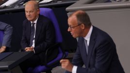  German Chancellor Olaf Scholz (L) looks on as Friedrich Merz, leader of the German Christian Democrats speaks at the Bundestag on September 11, 2024. Photo by Sean Gallup/Getty Images