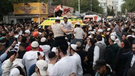 Ultra-Orthodox Jewish pilgrims dance near the tomb of Rabbi Nachman. Photo: PAP/EPA/MAXYM MARUSENKO