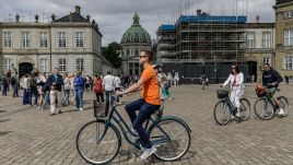 COPENHAGEN, DENMARK - 2024/05/24: People are on Amalienborg Square near the Royal Palace and Frederik's Church in the center of Copenhagen. (Photo by Volha Shukaila/SOPA Images/LightRocket via Getty Images)