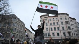 Syrians in Berlin celebrate the fall of the Assads' regime. Photo by Halil Sagirkaya via Getty Images