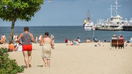 People sunbathing on the beach near the Sopot pier on the shore of the Baltic Sea during a summer day are seen in Sopot, Poland on July 14, 2023. Photo: Michal Fludra/NurPhoto via Getty Images