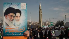 Illustrative photo: A man is holding a placard featuring portraits of Iran's Supreme Leader Ayatollah Ali Khamenei (L), and the late Leader Ayatollah Ruhollah Khomeini, as the Iranian Sejjil solid-fueled medium-range ballistic missile is being displayed at the Azadi (Freedom) square in western Tehran during a rally to mark the 45th anniversary of Iran’s 1979 revolution. February 11, 2024. Photo by: Morteza Nikoubazl via Getty Images. 