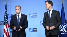 The U.S. Secretary of State (L) met NATO Secretary General Mark Rutte (R) in Brussels.