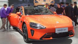 Visitors visit the Xiaomi SU7 electric car at the 2024 International Auto Show in Tianjin, China, on October 3, 2024. Photo: Costfoto/NurPhoto via Getty Images