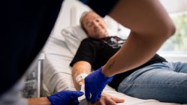 Janusz Racz receives the mRNA cancer immunotherapy drug at the University College London Hospital. Photo: Aaron Chown/PA Images via Getty Images