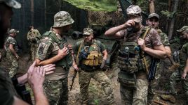 Ukrainian soldiers wait for combat order. Photo by Jose Colon/Anadolu via Getty Images