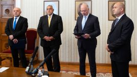 Rosen Zhelyazkov (R2), the prime ministerial candidate of the Citizens for European Development (GERB) party, which won the June 9 election in Bulgaria, presents the draft cabinet to President Rumen Radev (R) on July 01, 2024 in Bulgaria's Sofia. GERB leader Boyko Borisov (2L) also attended the ceremony. (Photo by Bulgarian Presidency/Handout/Anadolu via Getty Images)