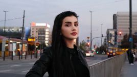 Nilofar Ayoubi stands next to the Dmowski roundabout in Warsaw. Photo by: Eliza Meller