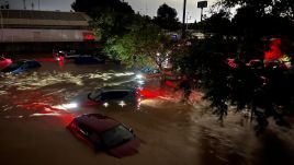  Cars are partly submerged in flood waters on October 29, 2024 on the western outskirts of Valencia. Spain's meteorological agency had issued its highest alert for the region due to extreme rainfall. Photo by Gonzalo Arroyo Moreno/Getty Images