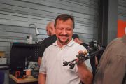 Engineer Sergiusz Drabinski displays one of the drones. Photo: Alex Webber