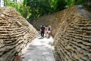 Woodland trails are bound by walls that vaguely resemble sandbag barricades. Photo: PAP/Andrzej Lange 