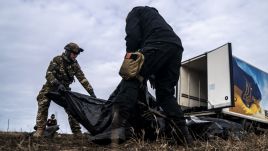 Volunteers of a group called Black Tulip prepare to examine personal belongings of two Russian soldiers. February 24, 2024. Photo: Jose Colon/Anadolu via Getty Images 