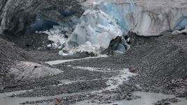 Ice breaks off the receding Findel glacier at a stream of the glacier's meltwater on June 22, 2022 near Zermatt, Switzerland. Photo: Getty Images